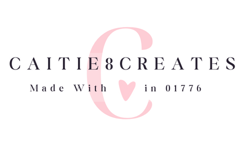 Logo with 'Caitie Creates' text and a pink heart on a white background